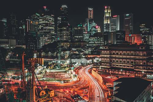 city timelapse photo of city with vehicles singapore