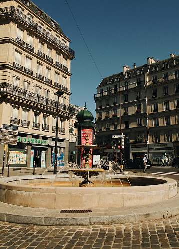 city water fountain near building downtown