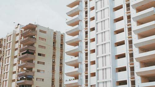 city white and brown concrete buildings at daytime high rise