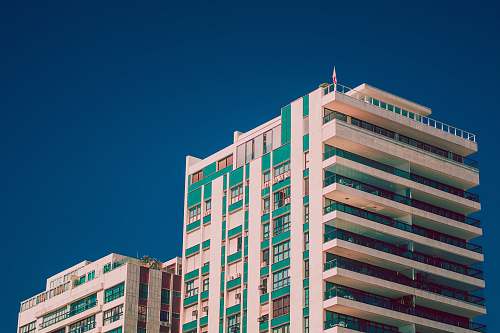 city white and green high-rise building housing