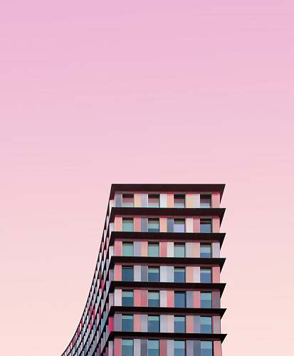 city white and pink concrete building during daytime urban