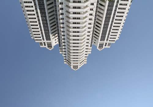 city white concrete building at daytime high rise