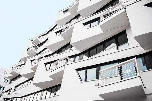 city white concrete building during daytime close-up photography high rise
