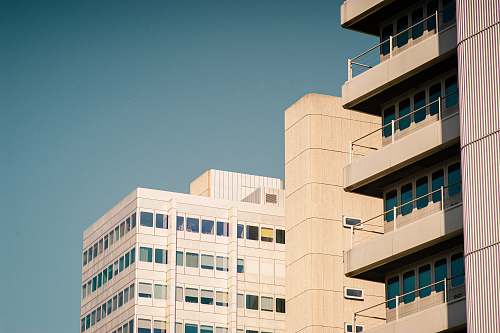 city white concrete high-rise building during daytime high rise