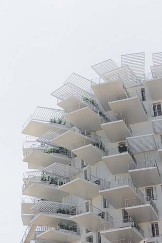 city white high rise building with balconies town