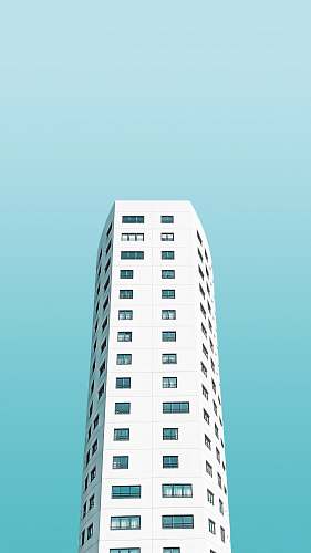 city white painted building under blue sky town