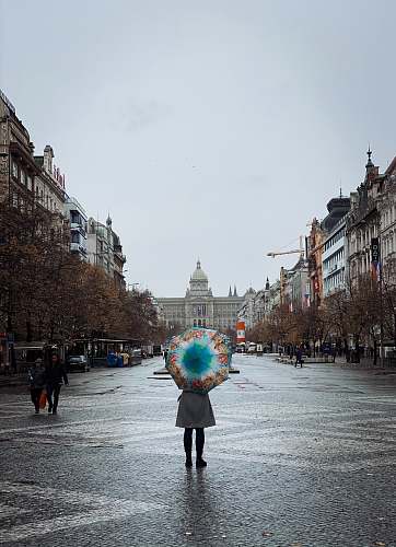 city woman holding an umbrella downtown