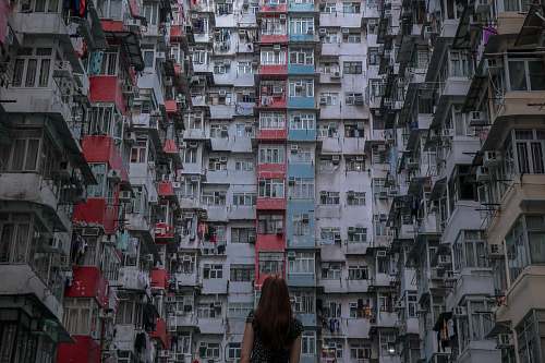 city woman in front of high rise building high rise