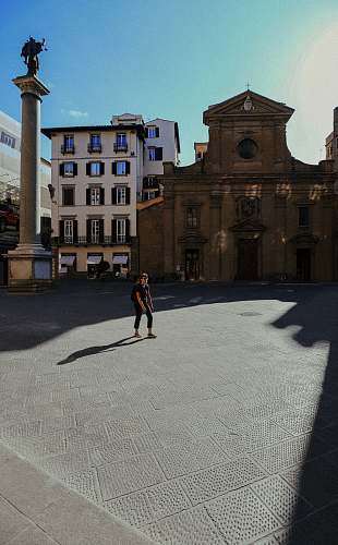 city woman standing on open space downtown