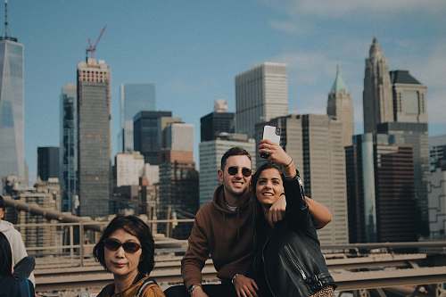 city woman wears black leather jacket town