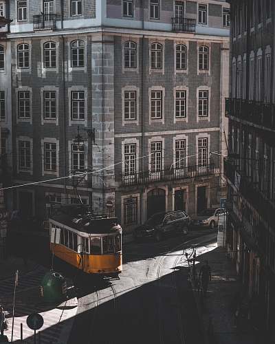 city yellow tram roaming on street tram