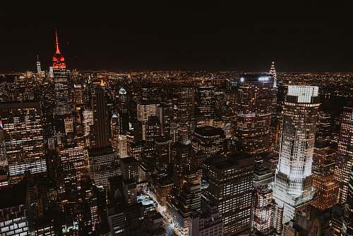 urban aerial photo of Empire State building during nighttime top of the rock