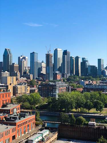 town aerial photography of buildings under clear blue sky building
