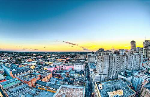 building aerial photography of city buildings during yellow sunset urban