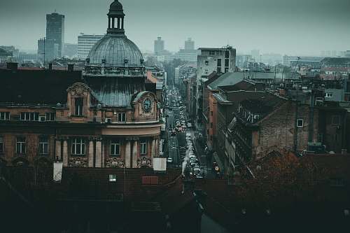 urban aerial photography of city with high-rise buildings and different cars on road metropolis
