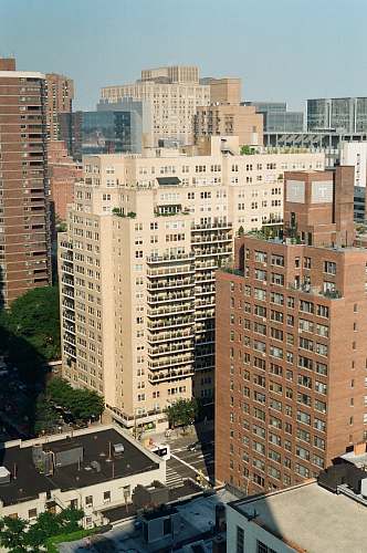 building aerial photography of city with high-rise buildings during daytime high rise