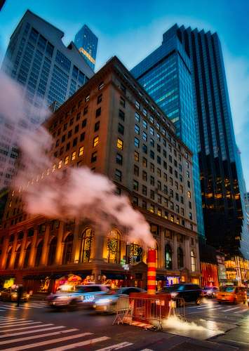 building architectural photography of brown concrete building metropolis