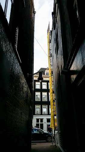 building black vehicle parked beside building street