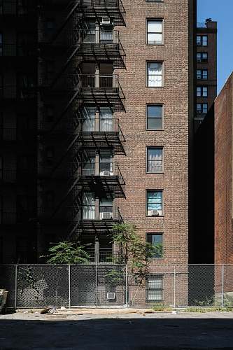building brown concrete building high rise