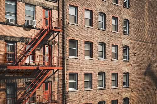 urban brown concrete building during daytime high rise