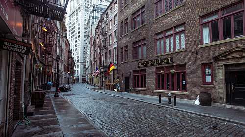 road brown concrete building with alley street