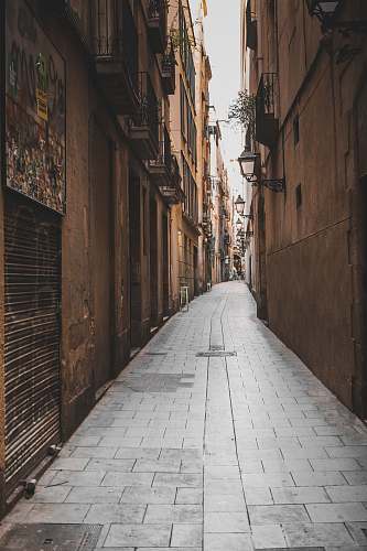 alley brown concrete houses with pathway building