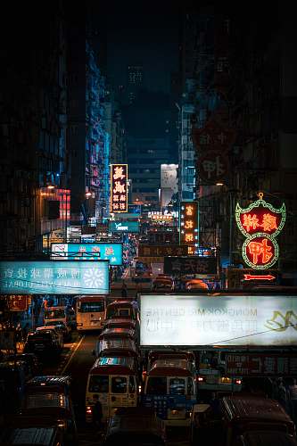 building cars on road surrounded by buildings urban