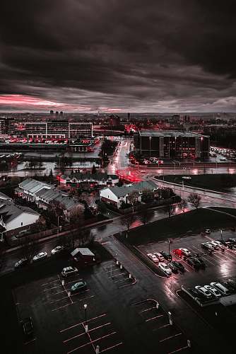 building city buildings and cars on grayscale photography urban