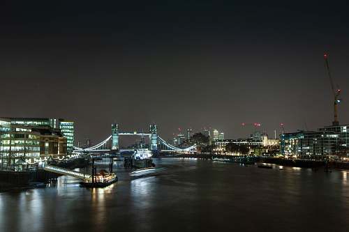 building city with bridge under nigh sky metropolis