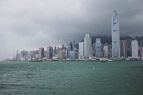 building city with high-rise buildings near sea grey