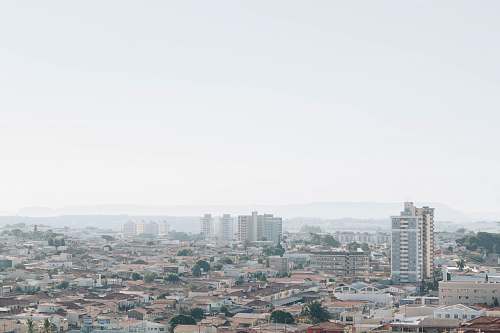 building cityscape under white sky grey