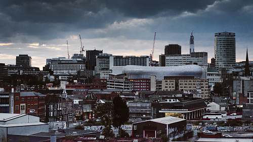 building concrete building and houses under gray sky birmingham