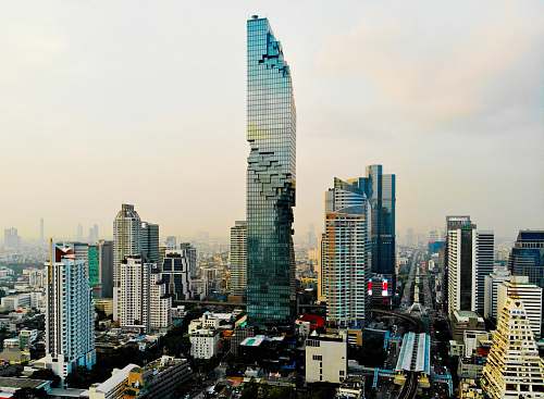building curtain wall high rise building under white sky high rise
