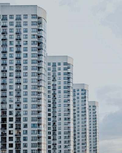 urban four white painted buildings high rise