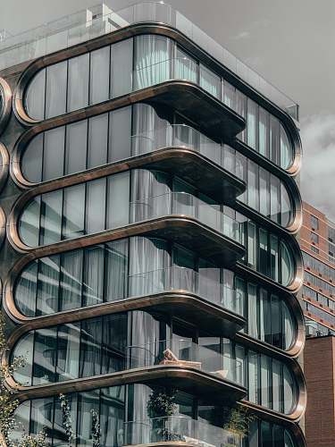 building gray and white glass-paneled building high rise