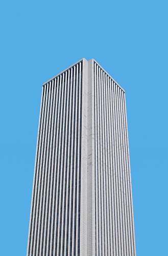 building gray concrete building during daytime high rise