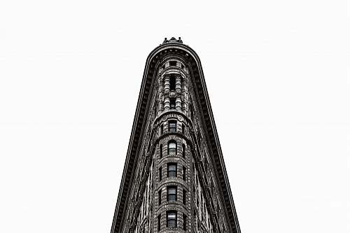 building gray concrete building in low angle photography black-and-white