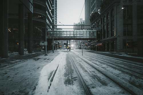urban gray empty road across building bridge street