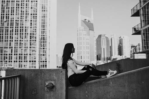 black-and-white grayscale photography of woman sitting person