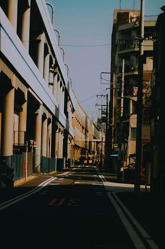 road grey concrete buildings during daytime building