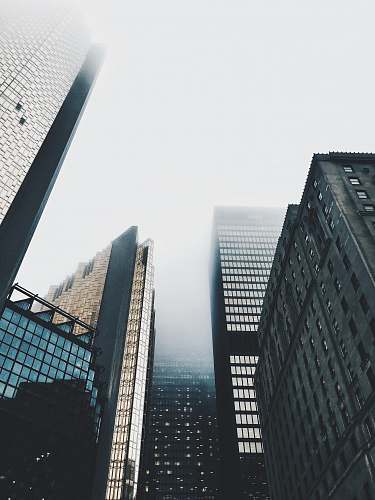 building high-rise buildings covered with fog architecture