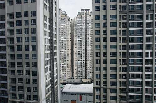 building high rise buildings under cloudy sky high rise