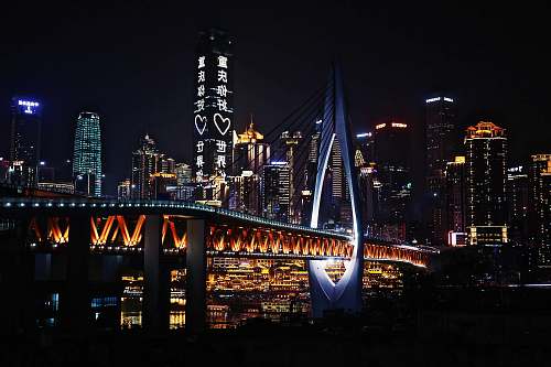 building lighted bridge metropolis