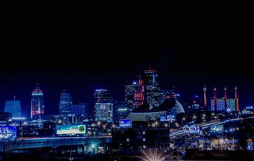 building lighted city building during nighttime metropolis