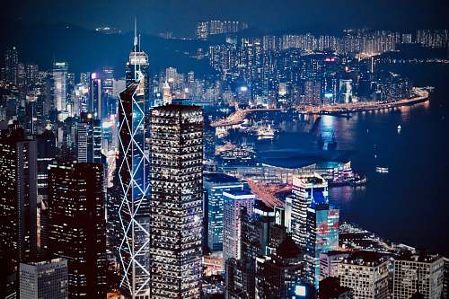 building lighted city skyline at night urban