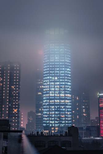 building lighted high rise buildings at night high rise