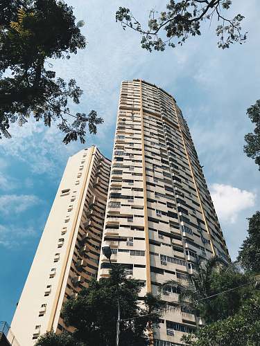 building low angle photo of concrete building high rise