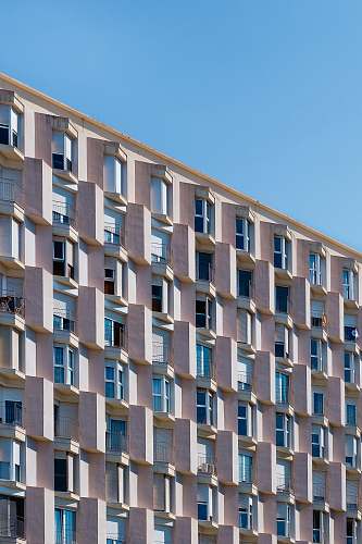 urban low angle photo of gray concrete building building