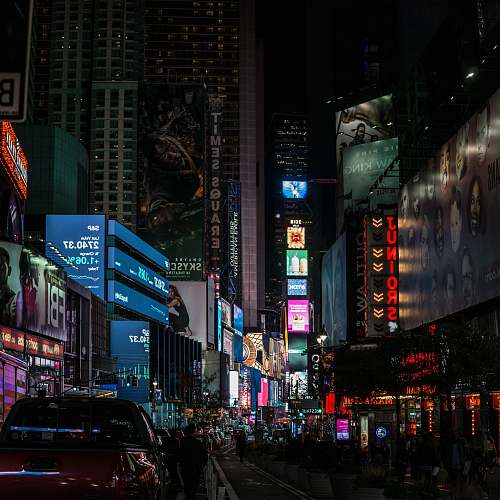 building low angle photo of lighted buildings metropolis
