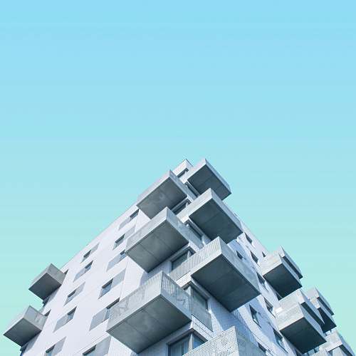 town low angle photography of concrete building during daytime building